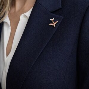 Elegant Red and White Airplane Brooch